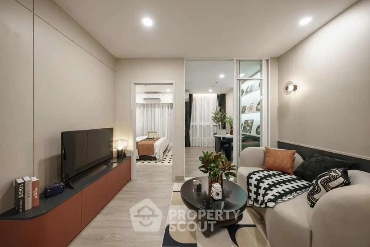 Modern living room with stylish decor and cozy ambiance in a contemporary apartment.