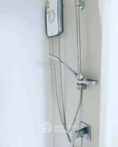 Modern bathroom shower with sleek design and water heater, perfect for contemporary living.