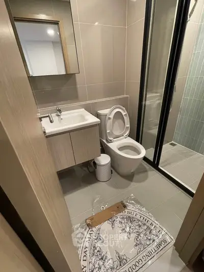 Modern bathroom with sleek design and glass shower enclosure