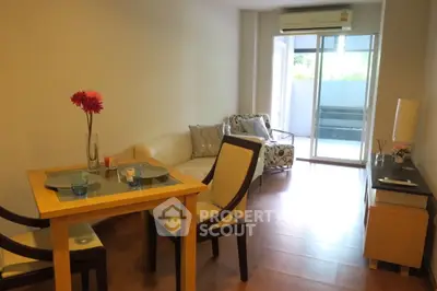Cozy living room with modern furniture and balcony access