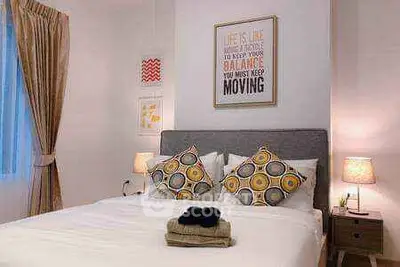 Cozy bedroom with stylish decor and comfortable bedding in modern apartment.
