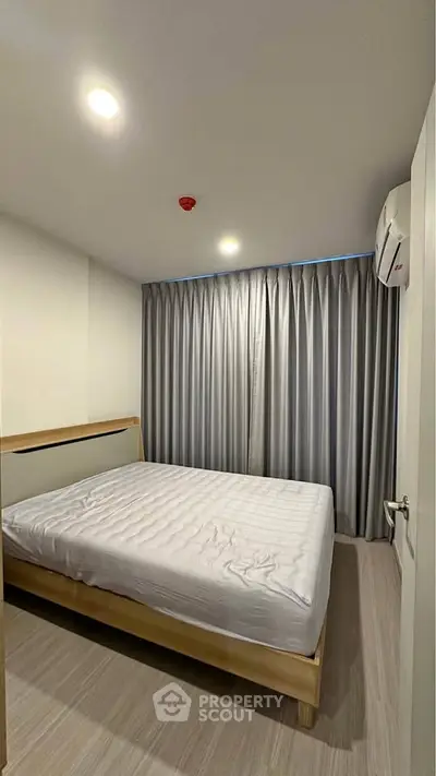 Modern bedroom with minimalist design and cozy ambiance.