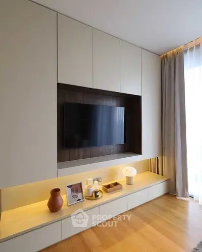 Modern living room with built-in TV unit and stylish decor