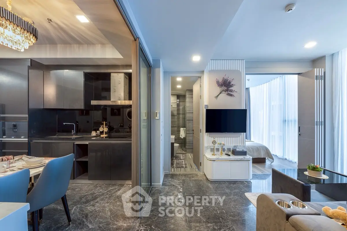 Luxurious open-plan living room with modern kitchen and elegant decor