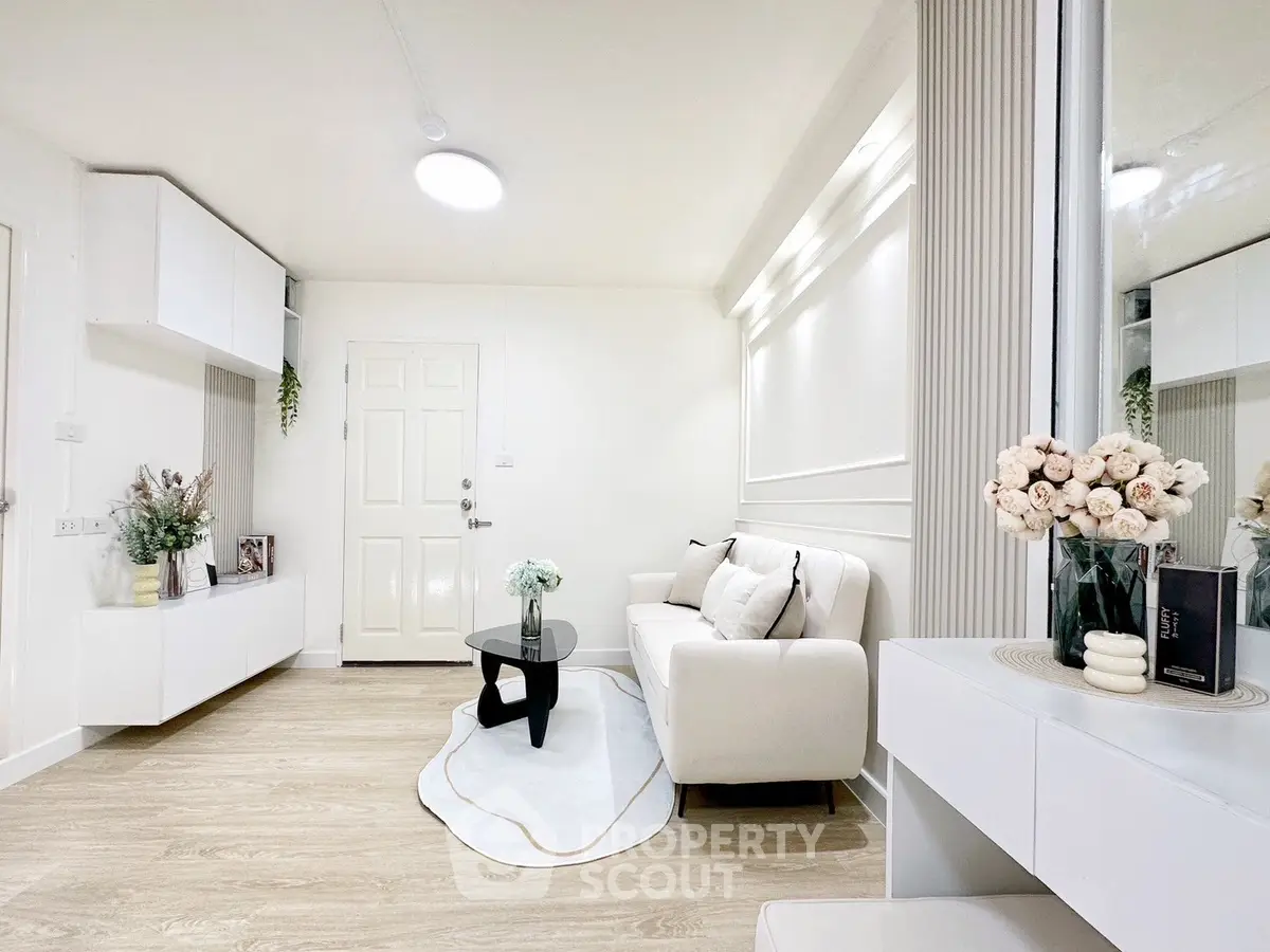 Bright modern living room with elegant decor and cozy seating area.