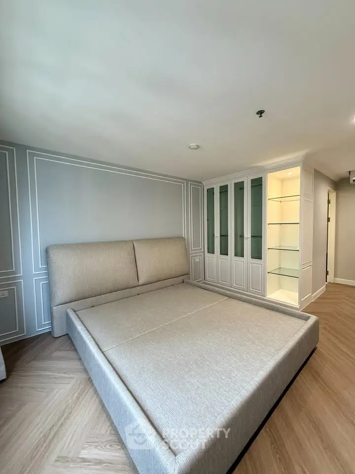 Spacious bedroom with elegant built-in wardrobe and modern design