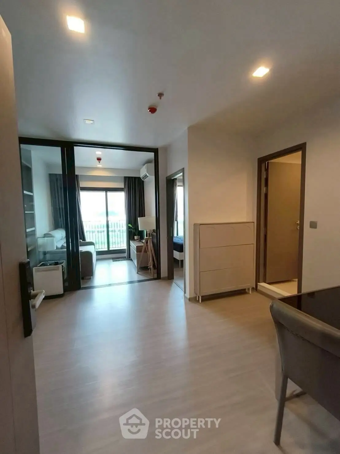 Modern apartment interior with open layout and balcony view