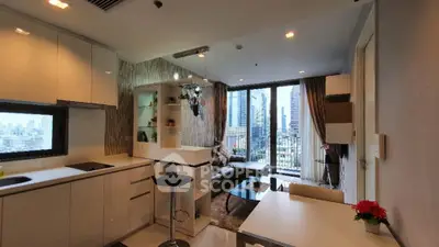 Modern open-plan living room with city view, stylish decor, and natural light