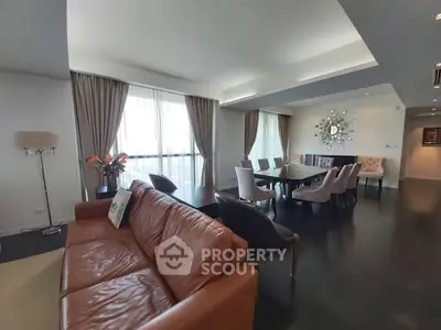 Spacious modern living room with elegant dining area and large windows