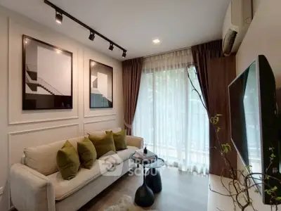 Modern living room with stylish decor and large window for natural light.