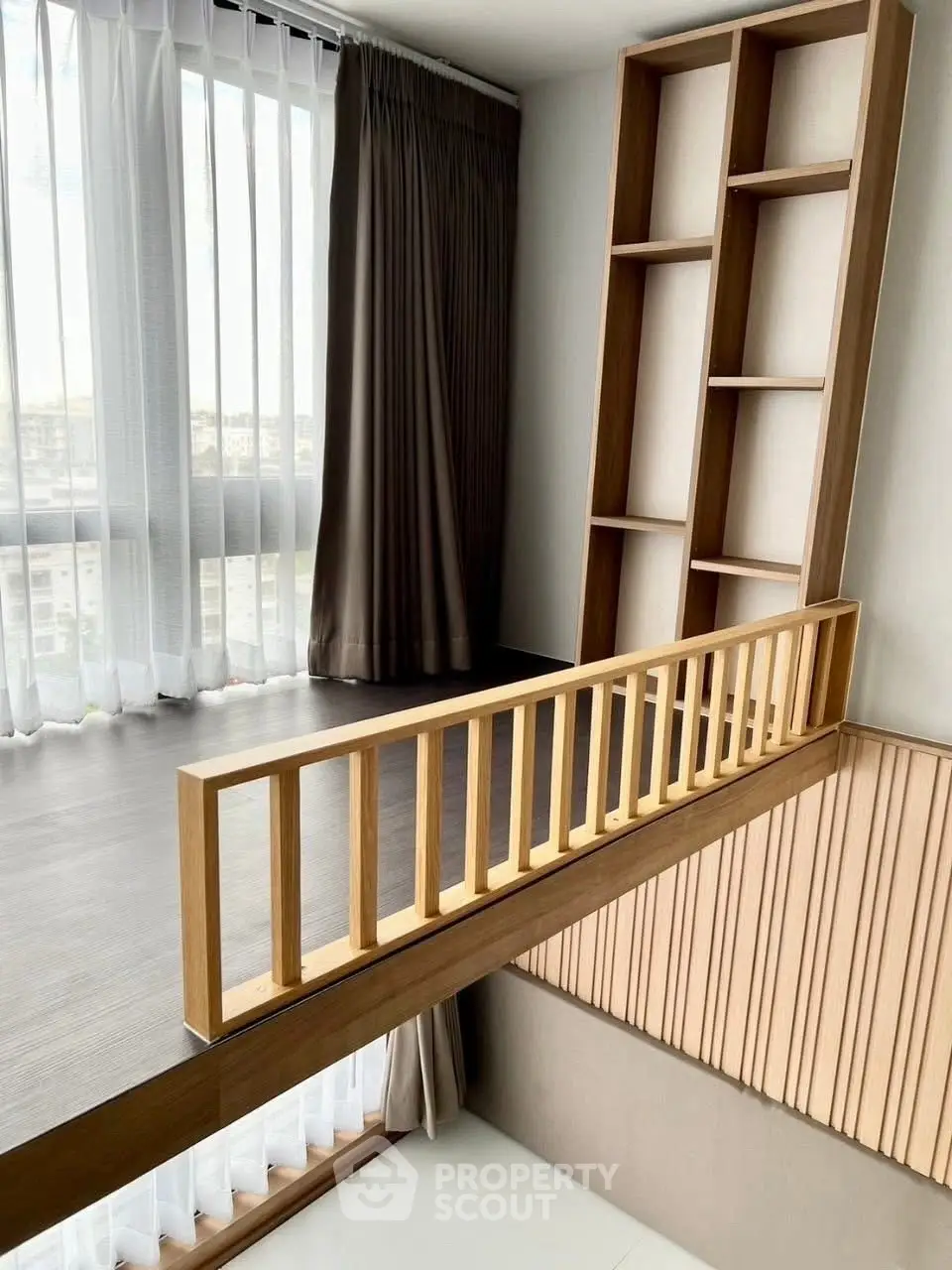 Modern loft with floor-to-ceiling windows and stylish wooden accents