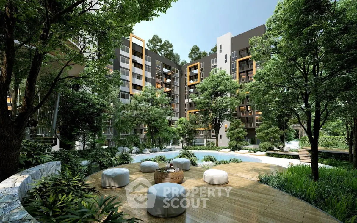 Luxurious modern apartment complex with lush greenery and stylish outdoor seating area.