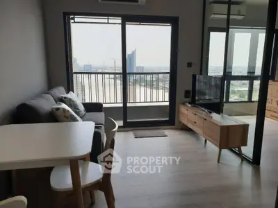 Modern living room with river view and stylish furniture in high-rise apartment
