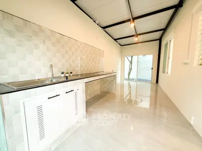 Modern kitchen with sleek design and ample natural light