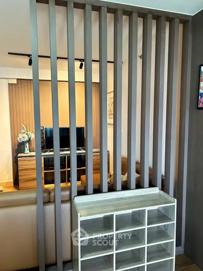 Modern living room with stylish wooden partition and cozy seating area