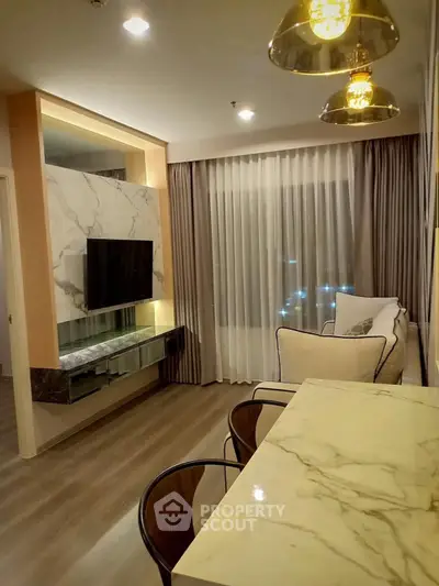 Elegant modern living room with marble accents and stylish lighting