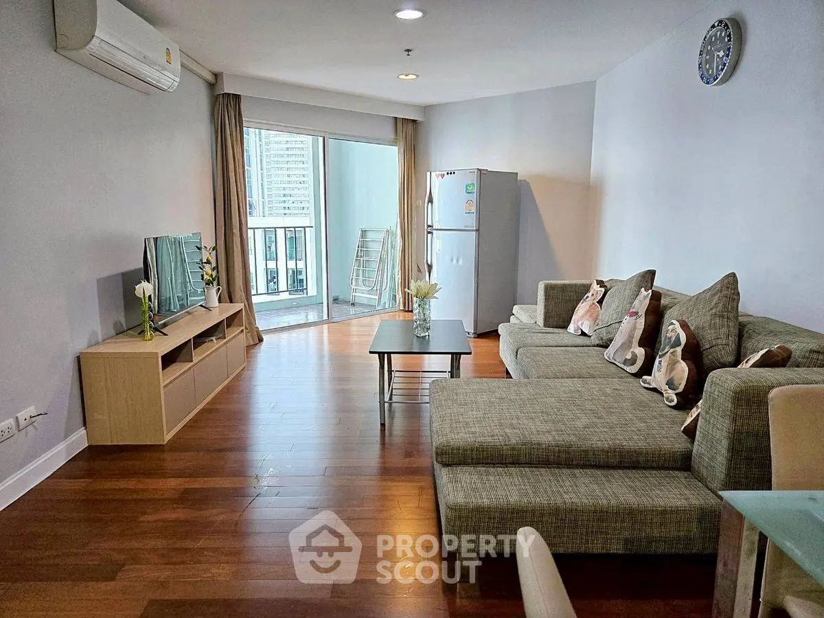 Spacious modern living room with balcony and stylish decor
