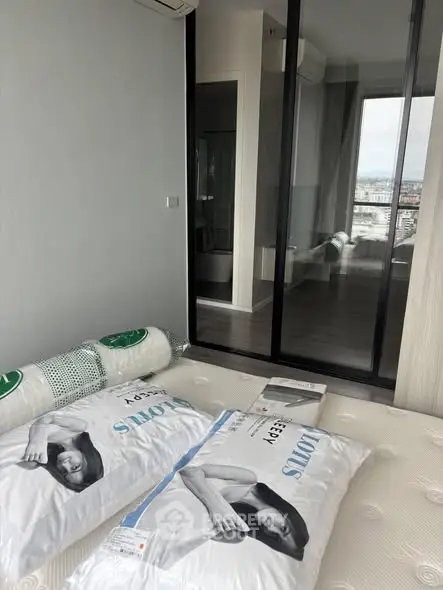 Modern bedroom with glass sliding doors and city view