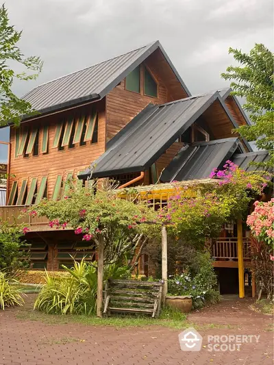 Charming wooden house with lush garden and unique architectural design