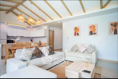 Spacious modern living room with open kitchen and stylish decor