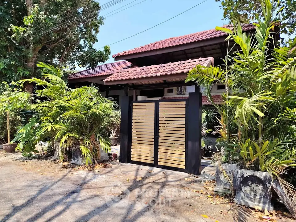 Charming suburban home with lush greenery and modern gate design