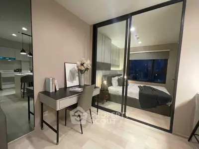 Modern apartment with stylish bedroom and study area, featuring sleek design and city view.