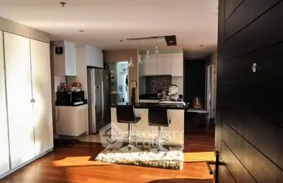 Modern kitchen with sleek design and bar seating in open layout