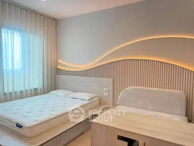 Modern bedroom with stylish lighting and comfortable bedding