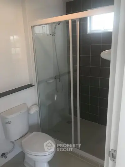 Modern bathroom with glass shower enclosure and sleek design