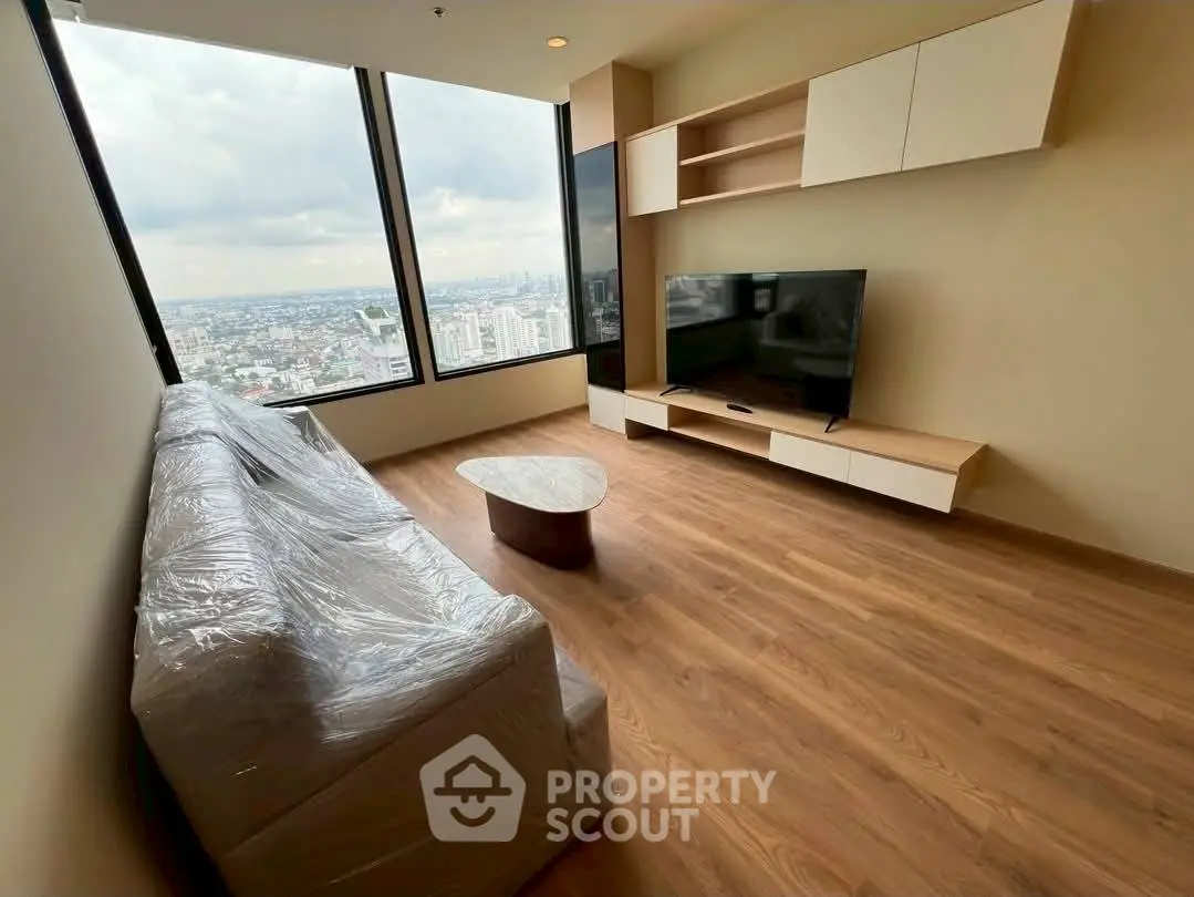 Modern living room with panoramic city view and stylish furniture