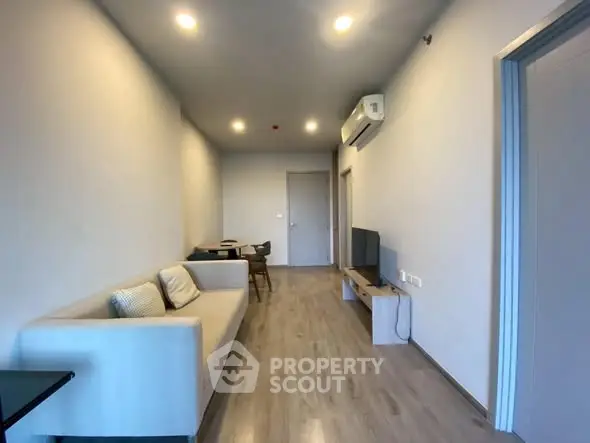 Modern living room with sleek furniture and air conditioning