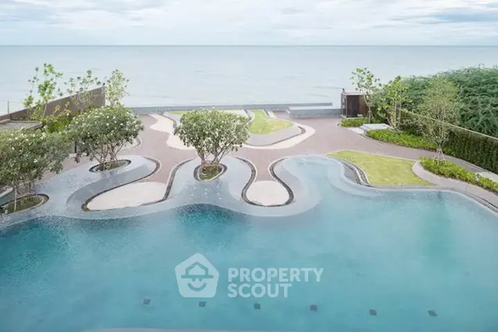 Luxurious beachfront pool with stunning ocean view and landscaped garden