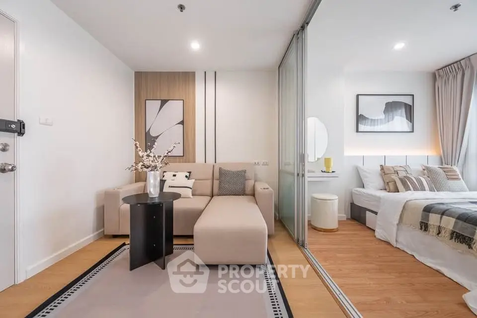 Modern living room with cozy sofa and stylish decor in a contemporary apartment.