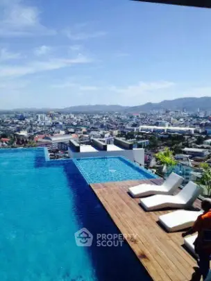 Luxurious rooftop infinity pool with stunning cityscape view
