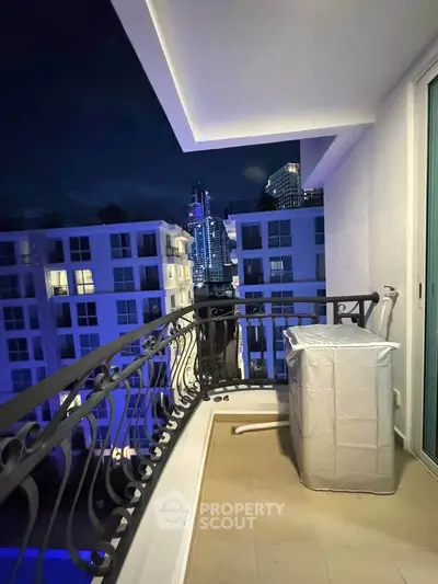 Chic urban balcony with stunning city skyline view at night