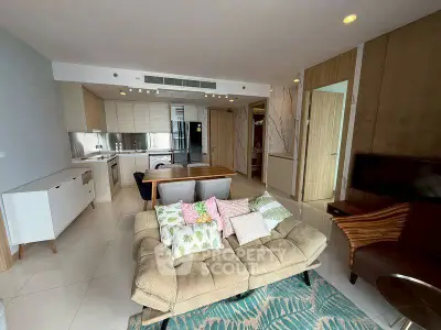 Spacious modern living room with open kitchen and stylish decor