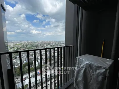 Stunning high-rise balcony with panoramic city views and modern design.