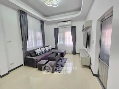 Modern living room with stylish gray furniture and elegant lighting
