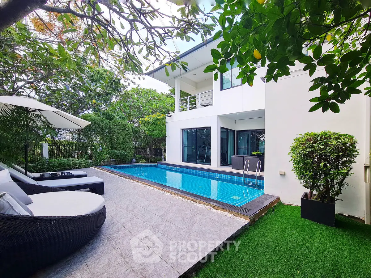 Luxurious modern home with private pool and lush garden, perfect for relaxation and entertaining.