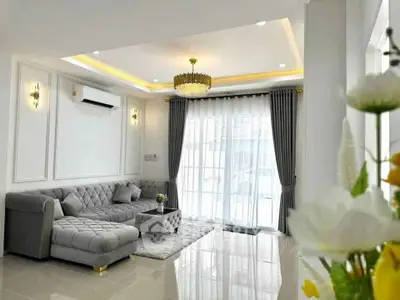 Elegant living room with modern decor and natural light