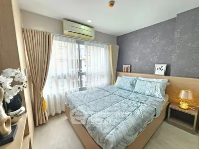 Cozy modern bedroom with stylish decor and ample natural light