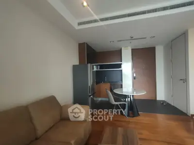 Modern apartment interior with cozy living area and compact kitchen