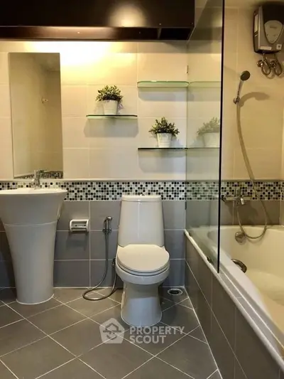Modern bathroom with elegant fixtures and stylish tile accents