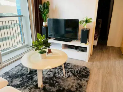 Stylish living room with modern decor and balcony view