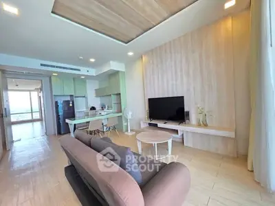 Spacious modern living room with open kitchen and stylish decor