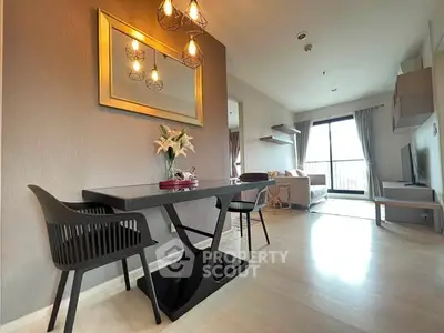 Modern living room with elegant dining area and stylish lighting, featuring a cozy seating arrangement and large window view.