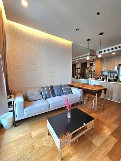 Modern living room with stylish decor and open kitchen layout