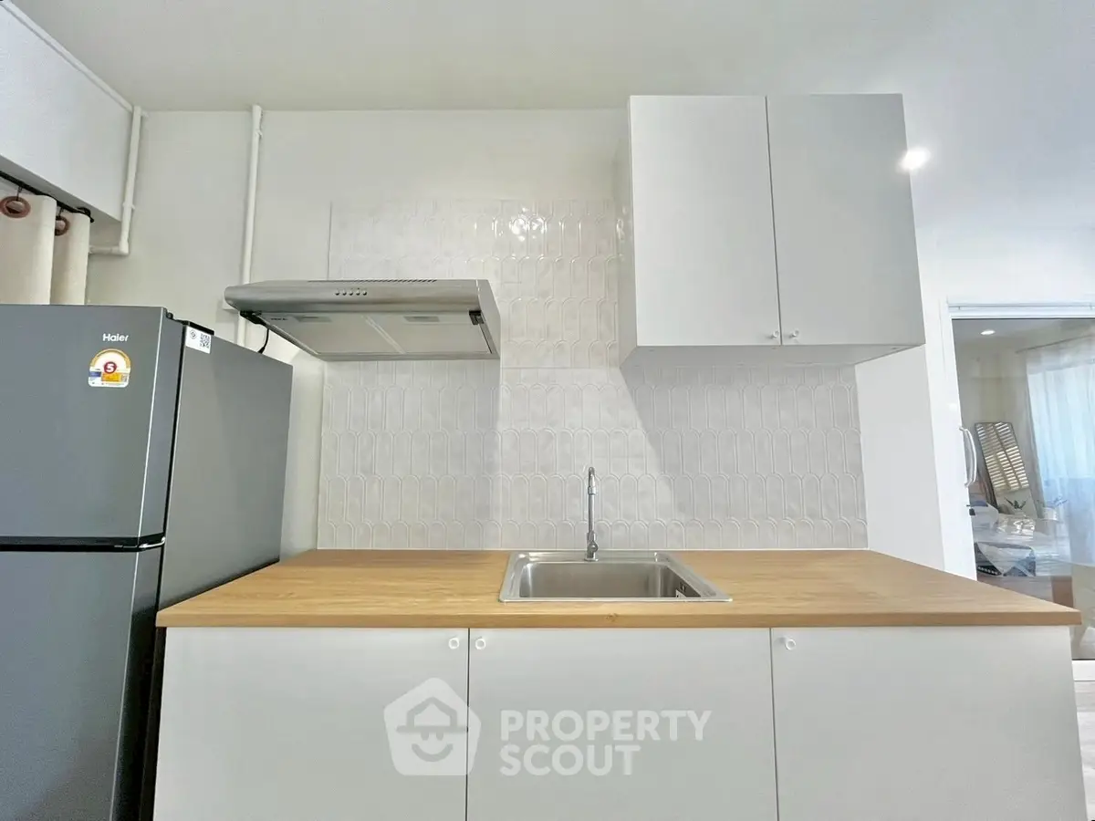 Modern kitchen with sleek cabinetry and stainless steel appliances