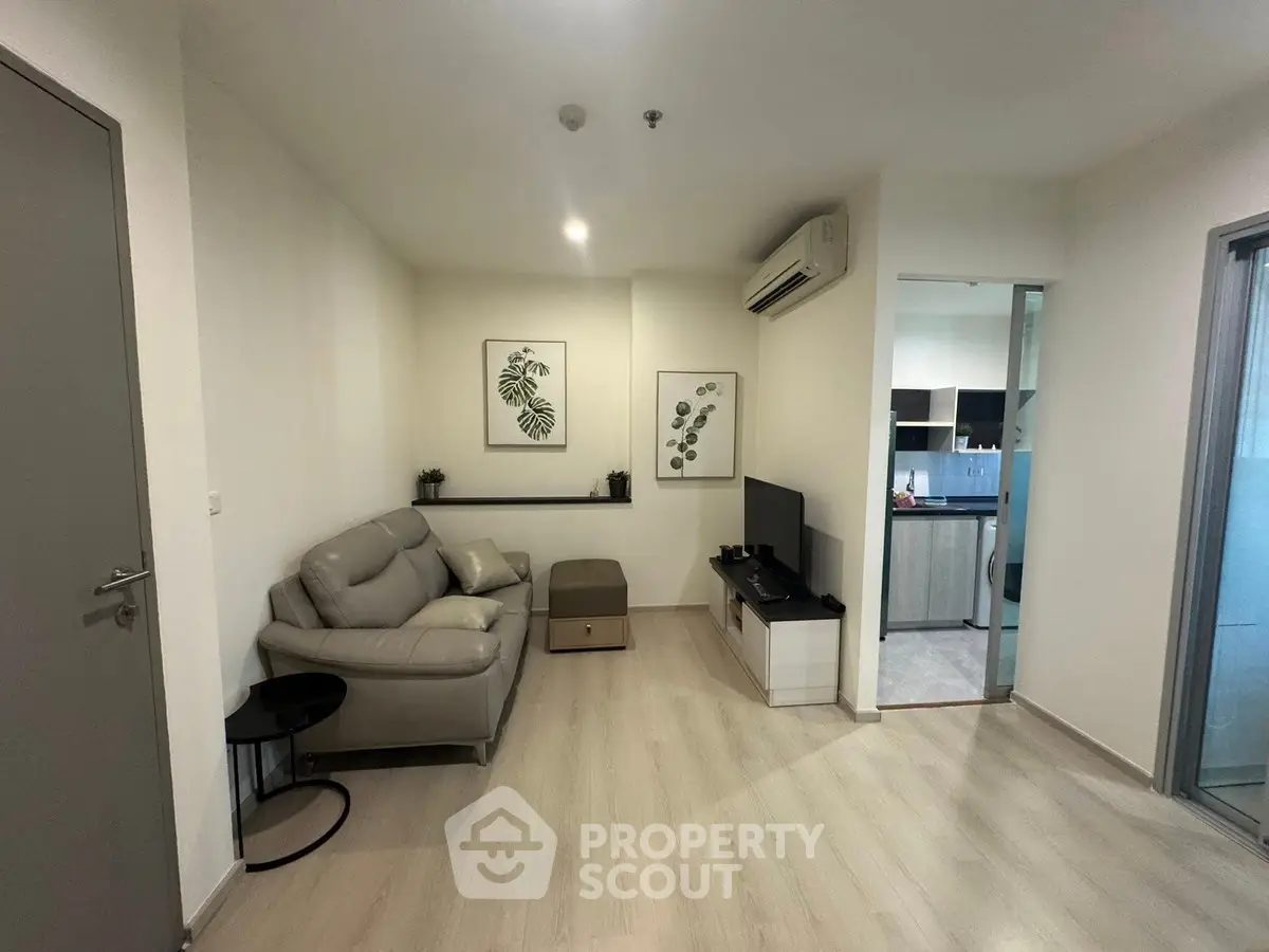 Modern living room with sleek design and open kitchen layout