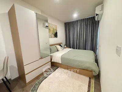 Modern bedroom with stylish decor and ample natural light